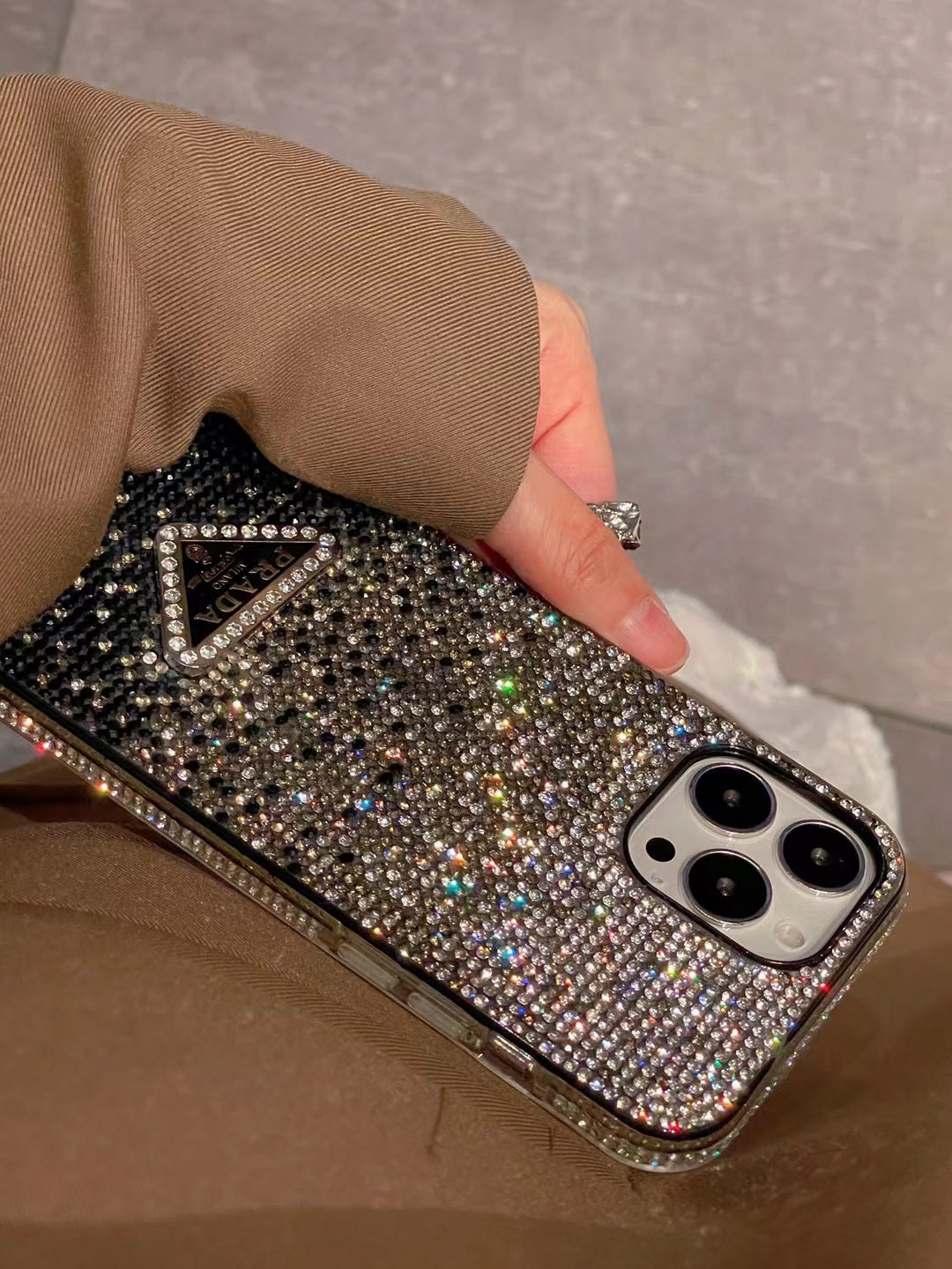 Luxury Prada Diamond iPhone Case packaging and accessories.