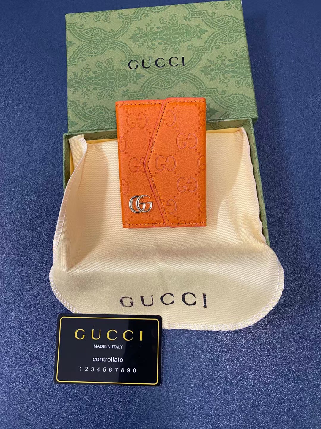 Chic Gucci wallet with sleek silhouette and embossed logo detail