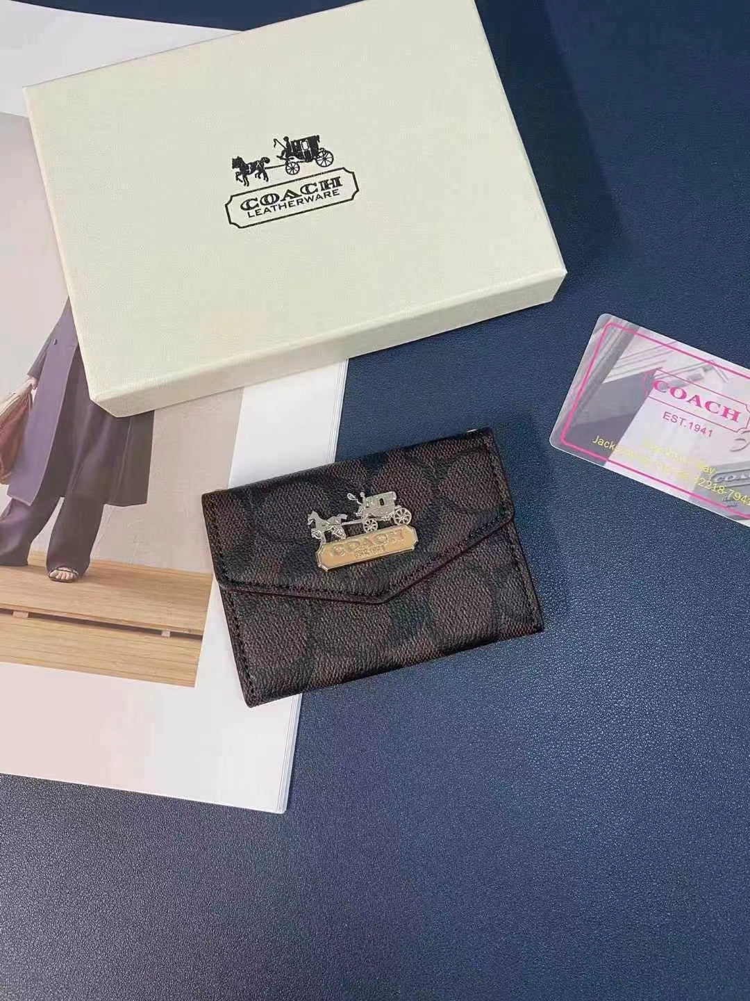 Coach Wallet and Card Holder Duo arranged with other luxury accessories