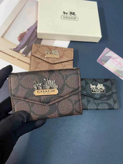 Coach Card Holder from the Sophisticated Duo, highlighting its compact and sleek design