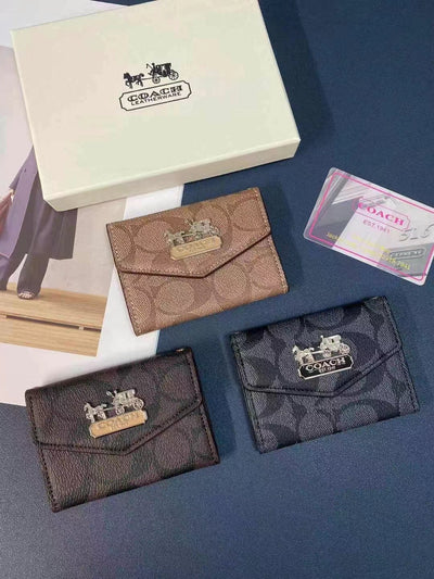 Sophisticated Coach Wallet and Card Holder Duo displayed on a sleek surface