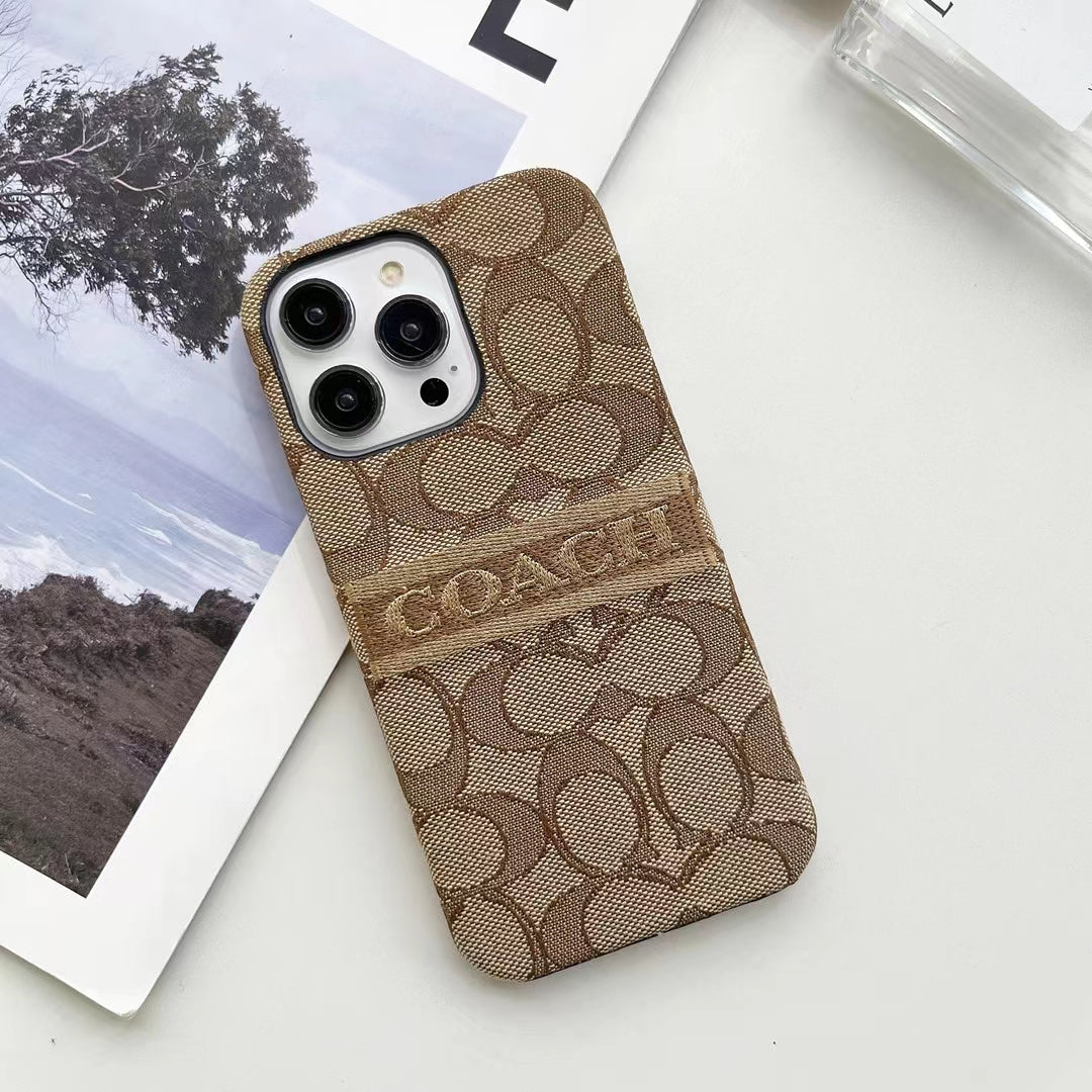 Flat lay of Coach Ladies' iPhone Case highlighting design