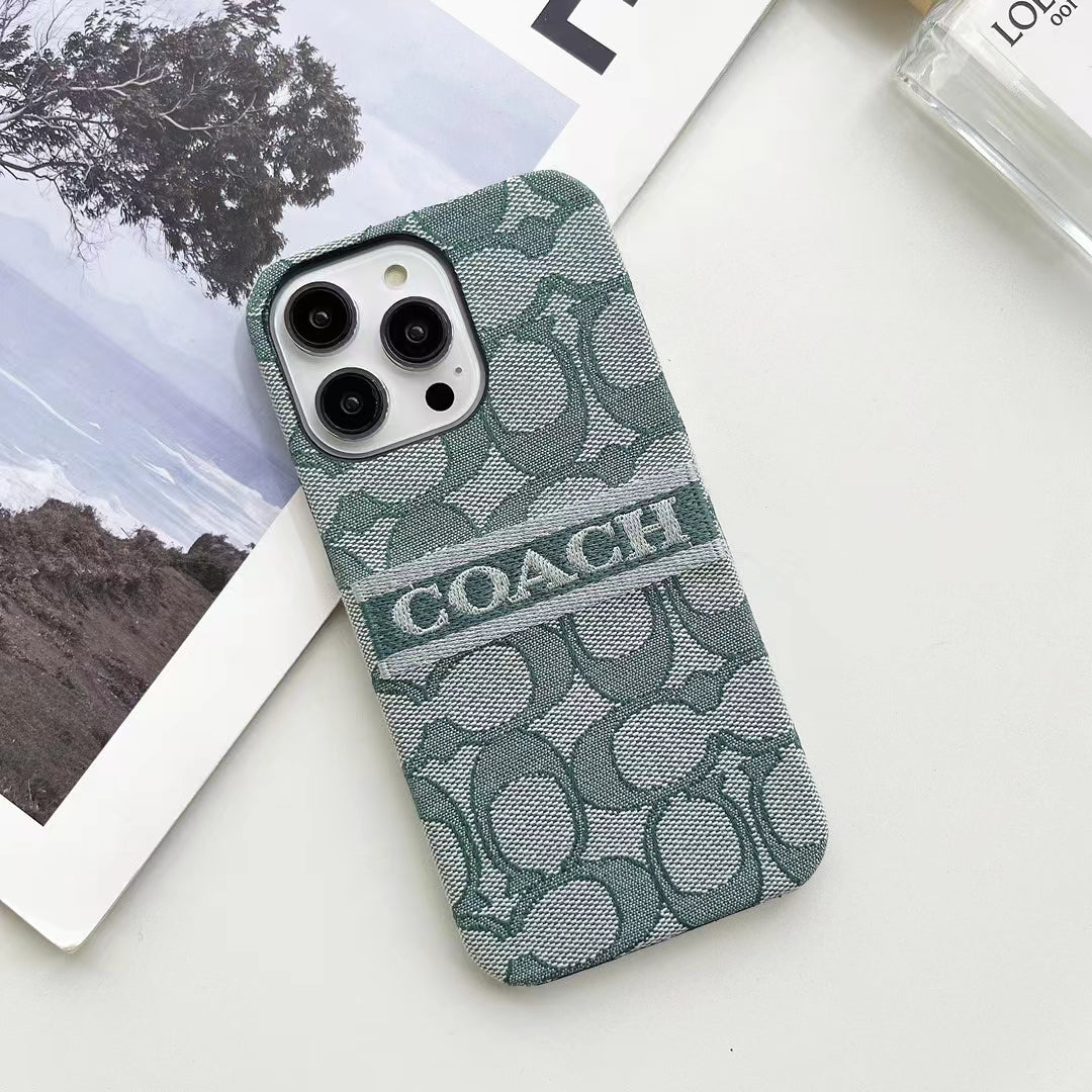 Flat lay of Coach Ladies' iPhone Case highlighting design