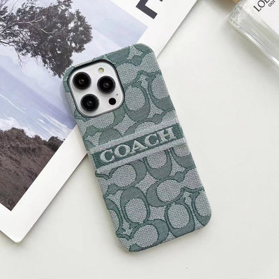 Flat lay of Coach Ladies' iPhone Case highlighting design