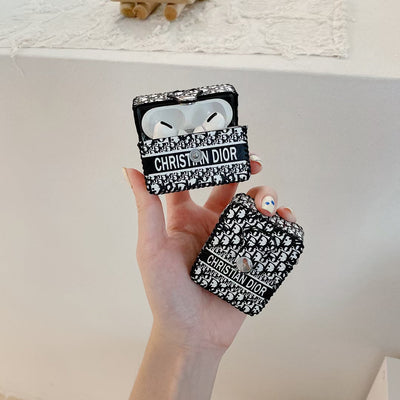 Dior Premier Chic AirPods Case open, revealing the snug fit for AirPods inside