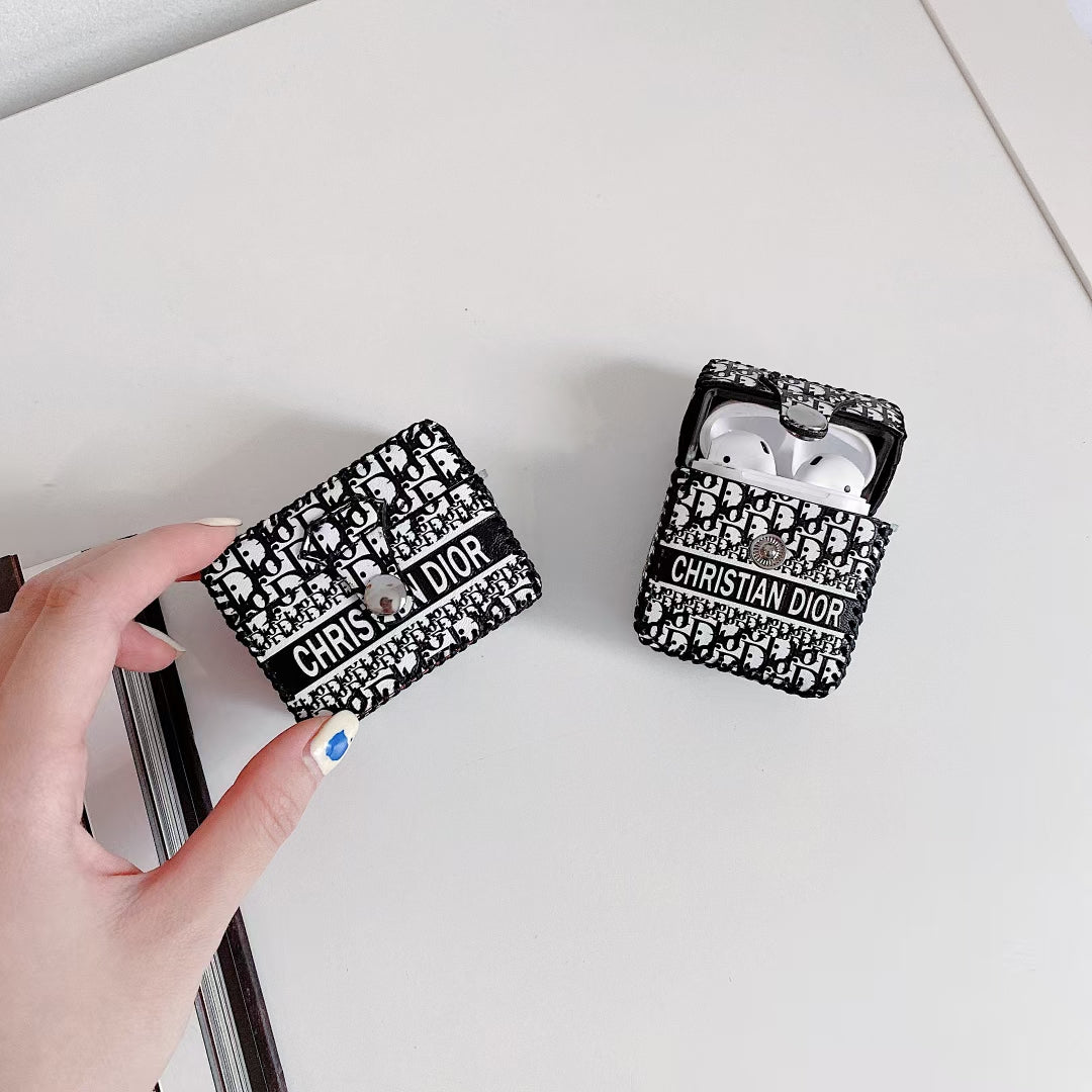 Dior Premier Chic AirPods Case displayed on a marble surface, highlighting its luxurious appeal