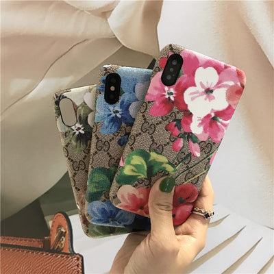 Designer Gucci iPhone case with vibrant blooms design
