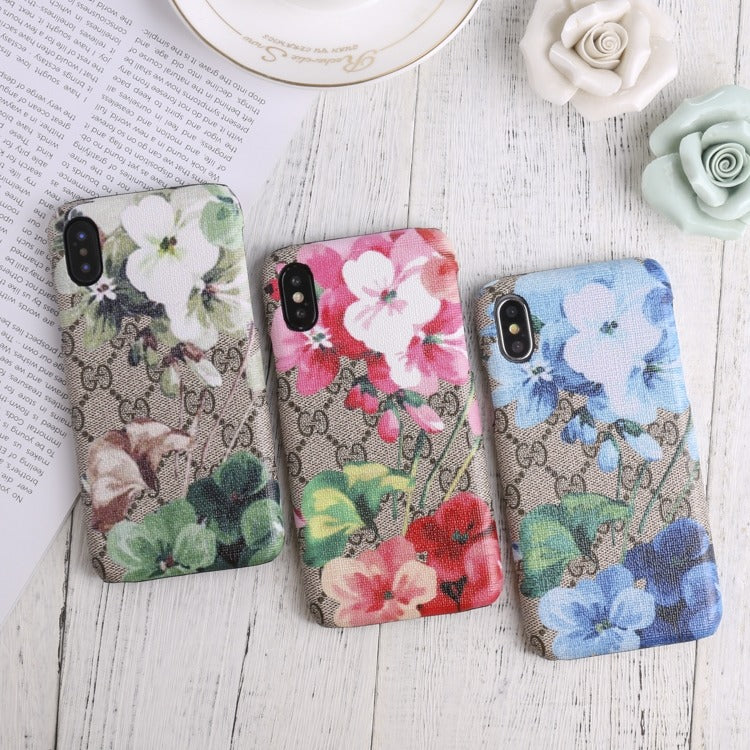 Designer Gucci iPhone case with vibrant blooms design