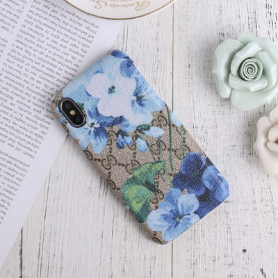 Designer Gucci iPhone case with vibrant blooms design