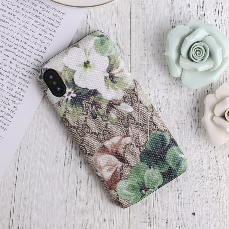 Designer Gucci iPhone case with vibrant blooms design