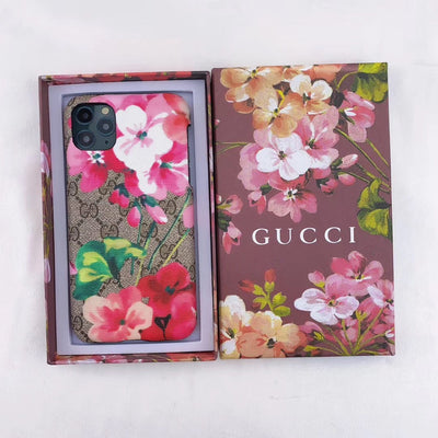 Designer Gucci iPhone case with vibrant blooms design