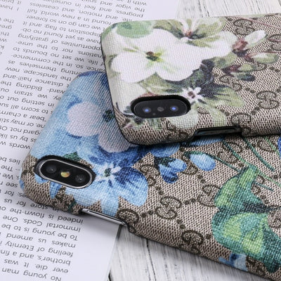 Designer Gucci iPhone case with vibrant blooms design