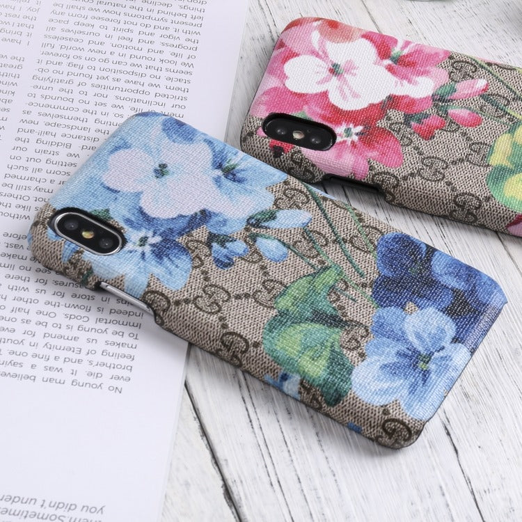 Designer Gucci iPhone case with vibrant blooms design