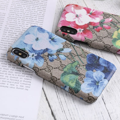 Designer Gucci iPhone case with vibrant blooms design